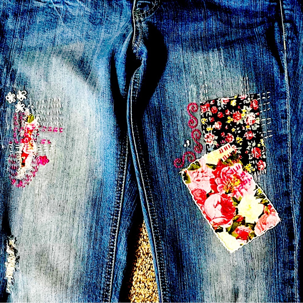Upcycled jeans with unique patchwork, and hand-stitched sashiko embroidery.